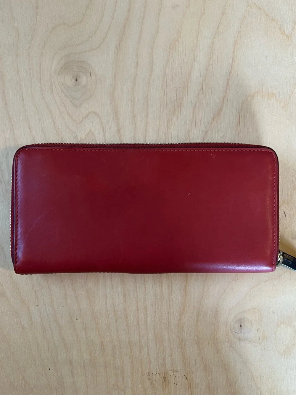 Tumi Red Leather Zip-Around Wallet with Black Trim
